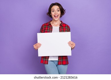 Photo of sweet young brunette lady hold placard wear red shirt isolated on purple color background - Shutterstock ID 2121283616