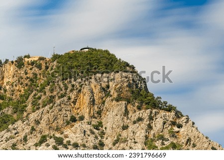 Photo taken with long exposure technique of Tunektepe mountain peak in Konyaaltı district of Antalya