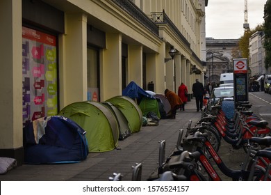Photo taken on the 15th November 2019 at Charring Cross Staion, London United Kingdom. Photo portrays tents and homeless issues within London. Photo also shows bikes and pedestrians. 