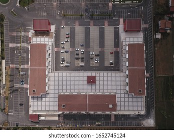 The photo was taken in the summer of 2019 with the help of a drone and a professional pilot. The photo shows a popular store in Italy. This is a large store that sells a lot of different products. 