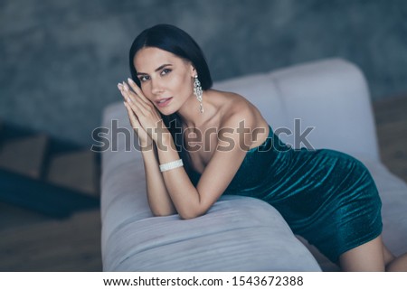 Photo of tenderness classy lady leaning on comfortable sofa waiting boyfriend home wear teasing classy formalwear short shiny mini dress apartments indoors