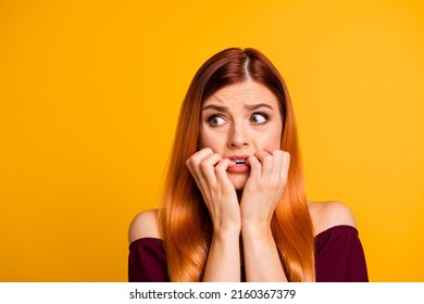 Photo Of Terrified Horrified Young Lady Biting Finger Nail Look Empty Space Isolated On Yellow Color Background