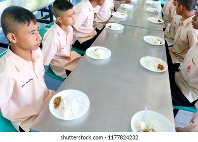 Photo Of Thai Students Are Arm Crossing Behind Before Eating Lunch In The Discipline Conduct At Paknampran School, Paknampran, Pranburi, Thailand December 3, 2018