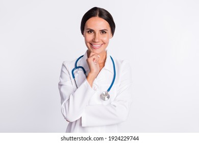 Photo of thoughtful cheerful young lady medic dressed uniform arm chin smiling isolated white color background