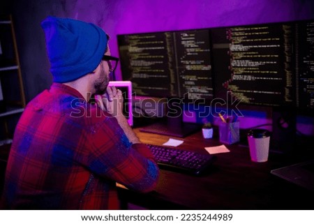 Photo of thoughtful confident guy dressed glasses hat thinking new java script indoors workstation workshop home