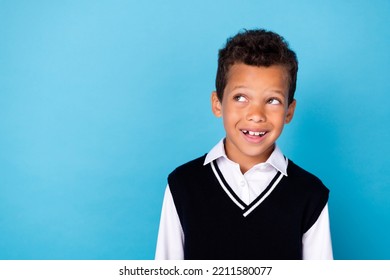 Photo Of Thoughtful Good Mood Little Guy Dressed Black Vest Looking Empty Space Isolated Blue Color Background