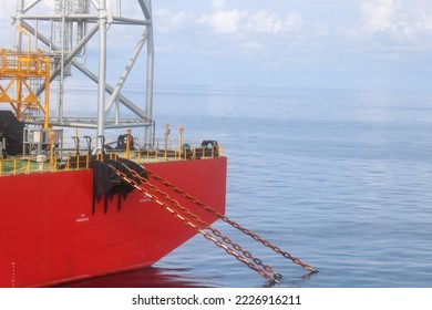 photo of three anchor chains dropped to keep the ship in position. anchor chain of a floating production unit (FPU)