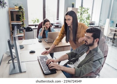 Photo Of Three Successful Intelligent Employee Browsing Computer Research Startup Keyboard Typing Indoors