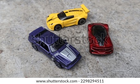 Photo of three toy cars that look just like the real cars