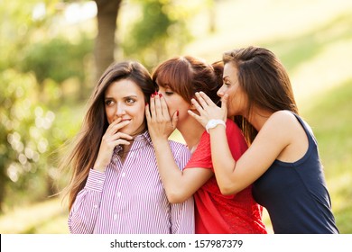 Photo Of Three Whispering Woman