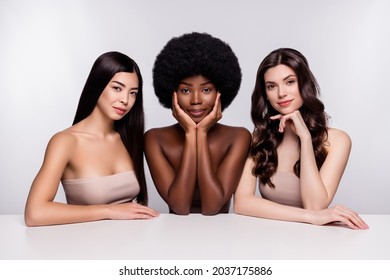 Photo of three young attractive woman hydration pampering silky pure skin isolated over grey color background