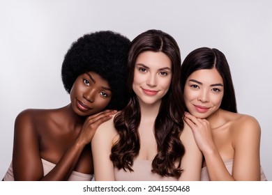 Photo of three young beautiful girls happy positive smile bodycare pure smooth skin isolated over grey color background