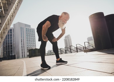 Photo of tired exhausted sportive pensioner man take break catch heavy breath sunset training urban town outdoors - Powered by Shutterstock