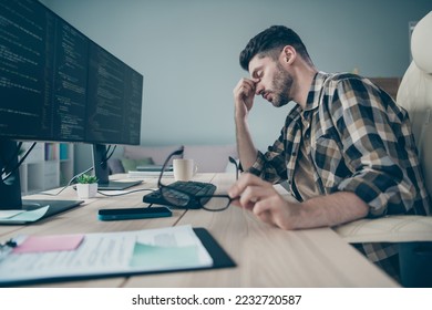 Photo of tires unhappy programmer holding spectacles hand head overworking indoors workplace workshop home - Shutterstock ID 2232720587