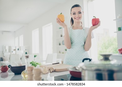 Photo Of Toothy Overjoyed Happy Smiling Girl Pretending To Be Cooking For Her Husband While He Does Not See Her Fooling