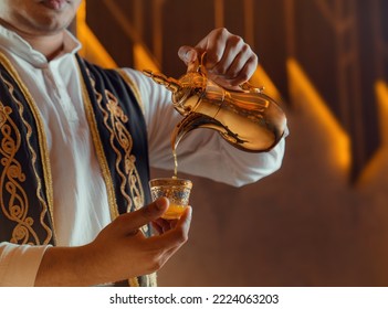 photo of traditional arabic coffee in dallah, Arabic Traditional Hospitality (Saudi Arabia). Arabic Man Hospitality  - Shutterstock ID 2224063203