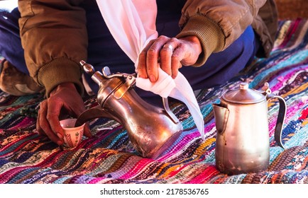 Photo of traditional arabic tea pot and cup. Bedouin tea, traditional tea