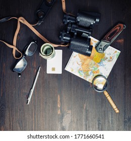 Photo Of Travel Accessories On Vintage Wood Table Background. Top View Of Personal Traveler's Items. Flat Lay.