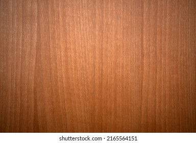 Photo Of A Tree Texture With Vertical Lines.Mahogany Wooden Background. Orange Background Made Of Wood Veneer In The Style Of The 70s.