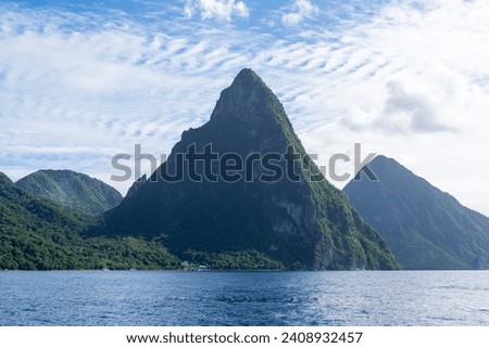 A photo of the Twin Pitons in St Lucia on a sunny day as seen from the Caribbean Sea.