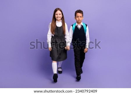 Photo of two best buddies schoolkids go school lesson with backpacks isolated purple color background