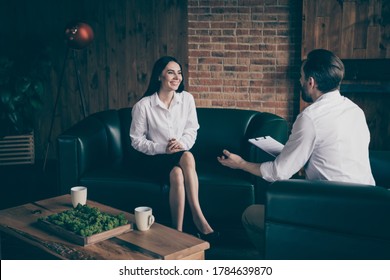 Photo Of Two Business People Lady Man Share News Drink Hot Coffee Mug, Beverage Chatting Friendly Interview Ask Answer Questions Formalwear Clothes Sit Couch Modern Office Indoors