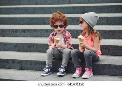 photo of two cute hipsters eating icecream