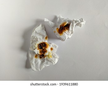 Photo Of Two Dirty Tissues In White Isolation.