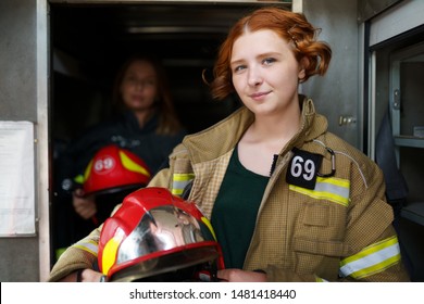 Photo Of Two Female Firefighters In Fire Truck