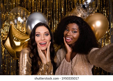 Photo of two festive ladies make selfie hold hands cheeks wear sequins dress balloons party isolated on shine bright background