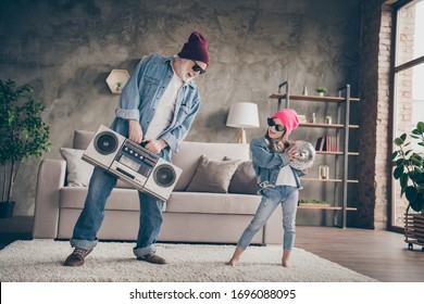 Photo Of Two People Funky Grandpa Small Granddaughter Cool Stylish Trendy Sun Specs Denim Clothes House Party Listen Tape Player Recorder Stay Home Quarantine Living Room Indoors