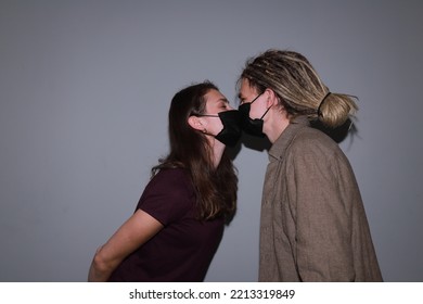 Photo Of Two People Kissing In Medical Masks