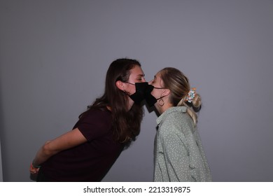 Photo Of Two People Kissing In Medical Masks