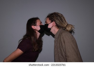 Photo Of Two People Kissing In Medical Masks