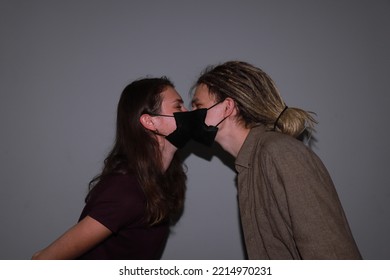 Photo Of Two People Kissing In Medical Masks