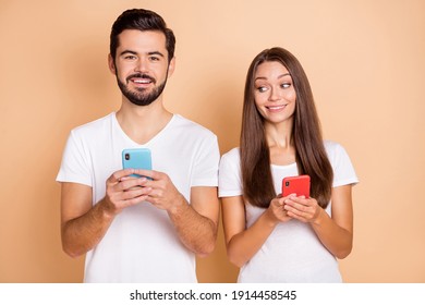 Photo of two persons attractive lady look handsome guy phone screen isolated on beige color background