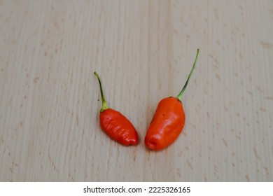 Photo Of Two Red Cayenne Pepper From The Top View.