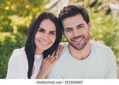 Photo Of Two Romantic People Sit Grass Girlfriend Touch Boyfriend Shoulder Wear Casual Clothes In Garden Park Outdoors