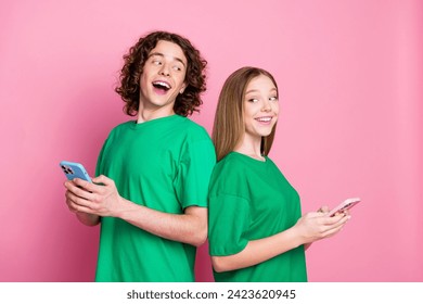 Photo of two teen friends young girl with boy order pizza bolt food delivery smartphone online payment isolated on pink color background - Powered by Shutterstock