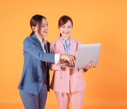 Photo Of Two Young Asian Businesswoman On Background