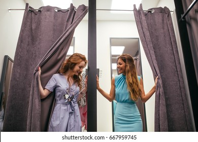 Photo of two young women in the fitting room.