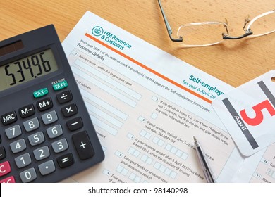 Photo Of A UK Self Employment Tax Form, The Deadline For The Tax Year Is 5th April As Shown By The Calendar.