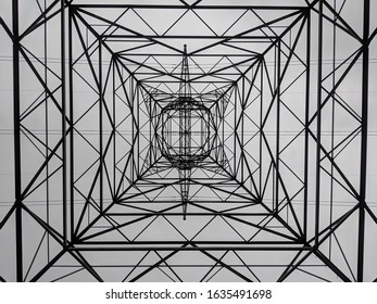 Photo from underneath Electrical Tower in Palmdale California. Amazing patterns and symmetry from the power grid.