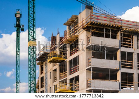 Photo of unfinished building with blue sky in the background in a sunny day