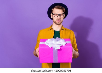 Photo Of Unhappy Disgusted Young Man Hold Hands Present Dislike Isolated On Purple Color Background