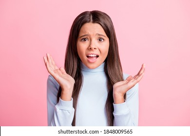 Photo Of Unhappy Mad Little Girl Hands Sides Disagree Open Mouth Isolated On Pastel Pink Color Background