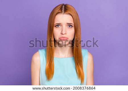 Photo of unhappy sad young sullen woman grief face cry bad mood isolated on pastel violet color background