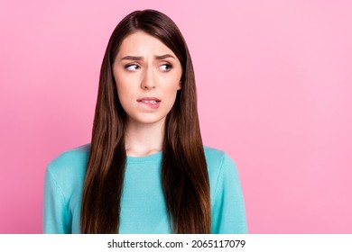 Photo Of Unhappy Stressed Worried Look Empty Space Wear Blue Sweater Isolated On Pink Color Background