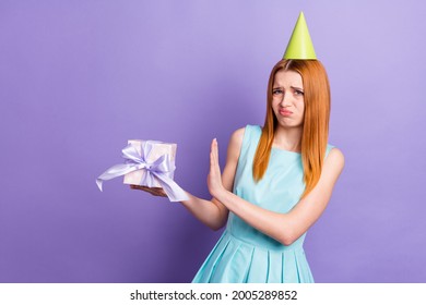 Photo Of Unhappy Upset Young Woman Dislike Disgust Present Bad Mood Party Isolated On Purple Color Background