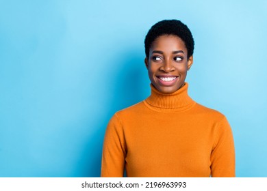 Photo Of Unisex Person Look Empty Space Beaming Smile Think Create Wear Yellow Shirt Isolated Blue Color Background